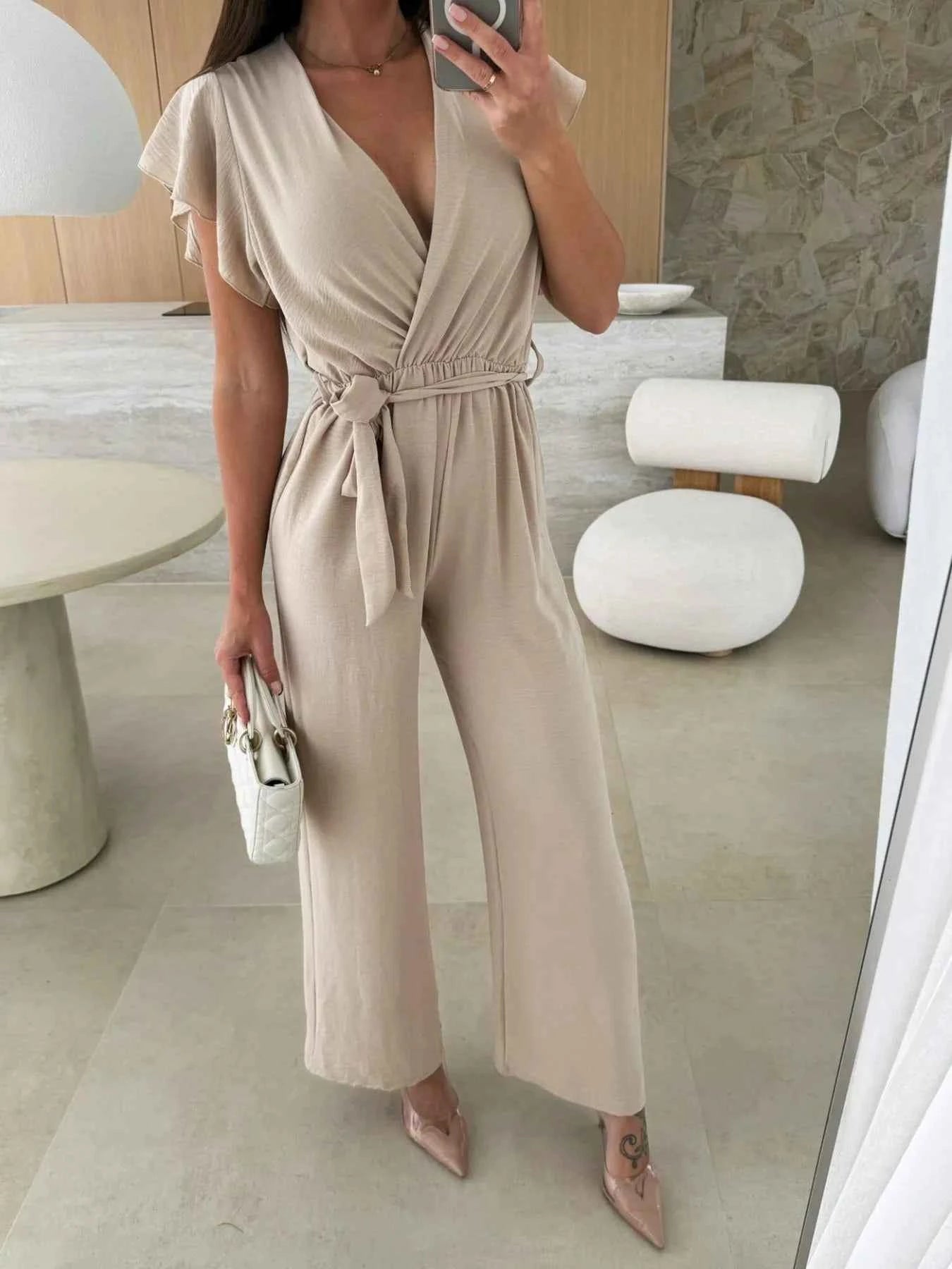 Surplice Wide Leg Belted Jumpsuit.