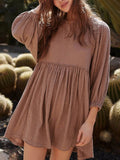 Relaxed Textured Babydoll Mini Dress with Keyhole Back.