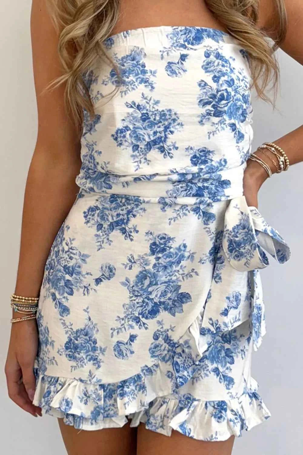 Printed Strapless Ruffle Hem Wrap Romper.