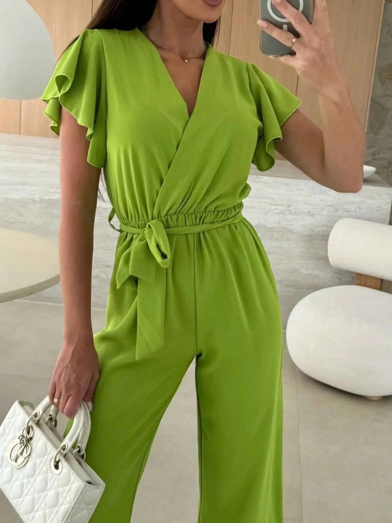 Surplice Wide Leg Belted Jumpsuit.