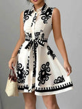 Printed Sleeveless Tie Waist Mini Dress.