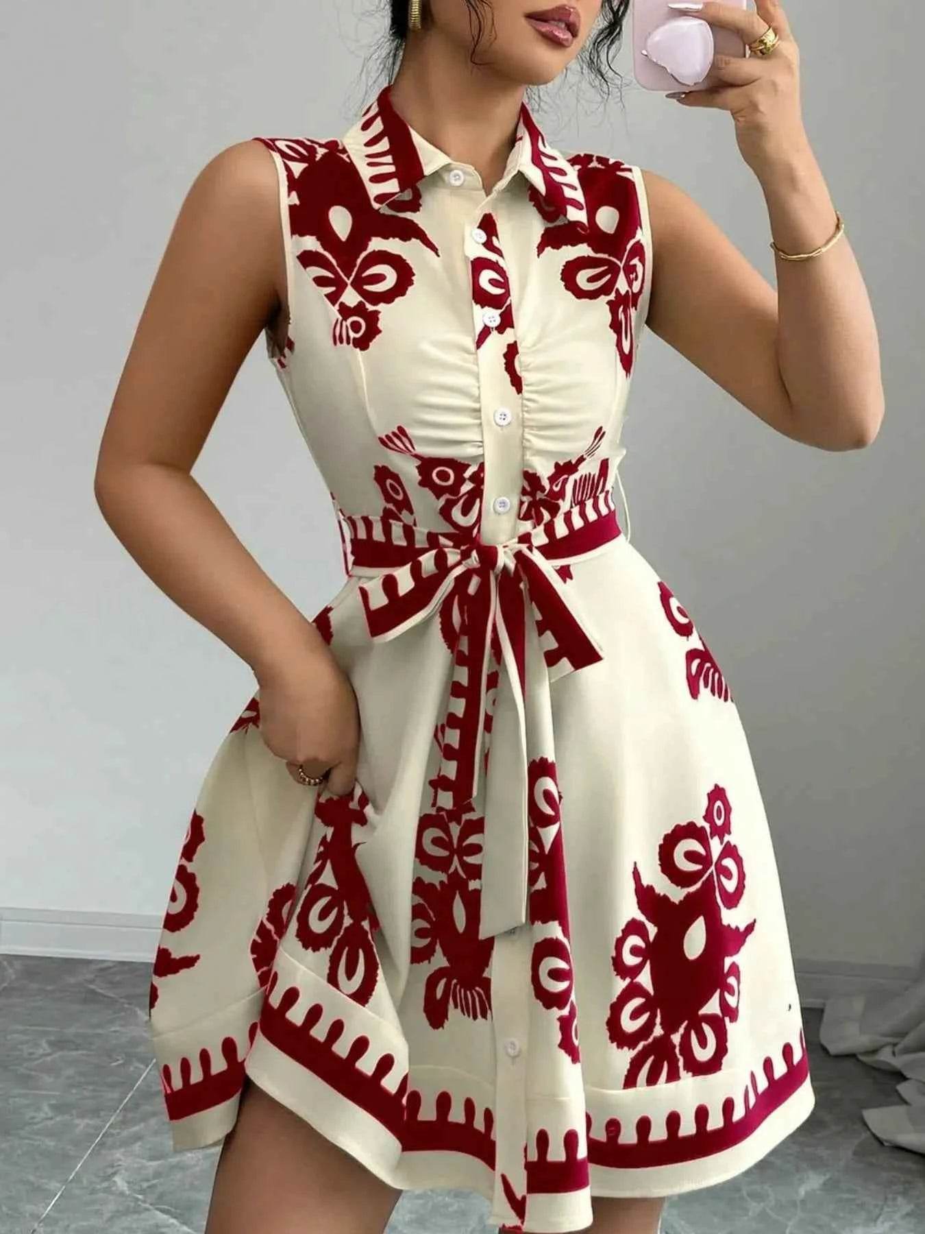 Printed Sleeveless Tie Waist Mini Dress.