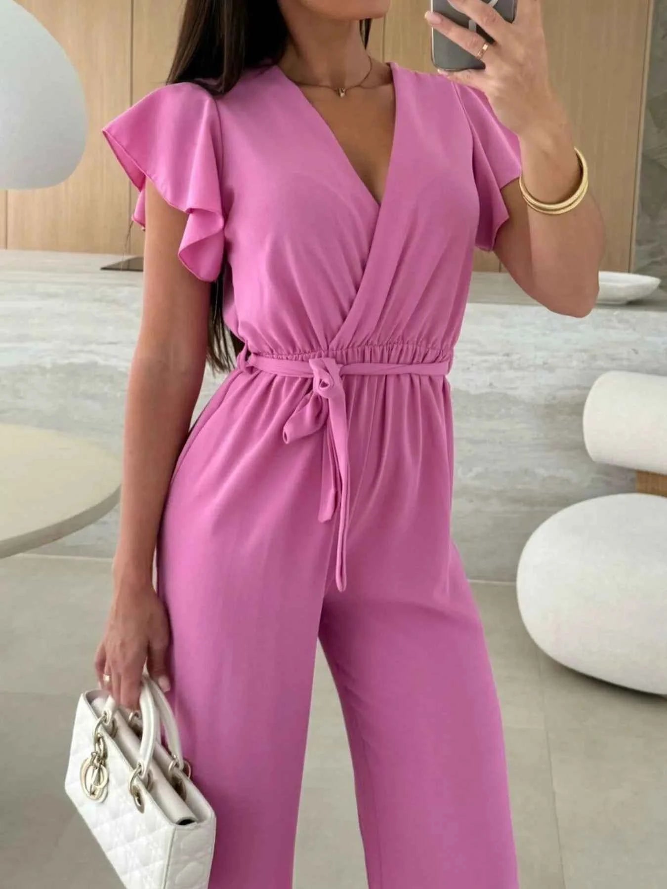 Surplice Wide Leg Belted Jumpsuit.