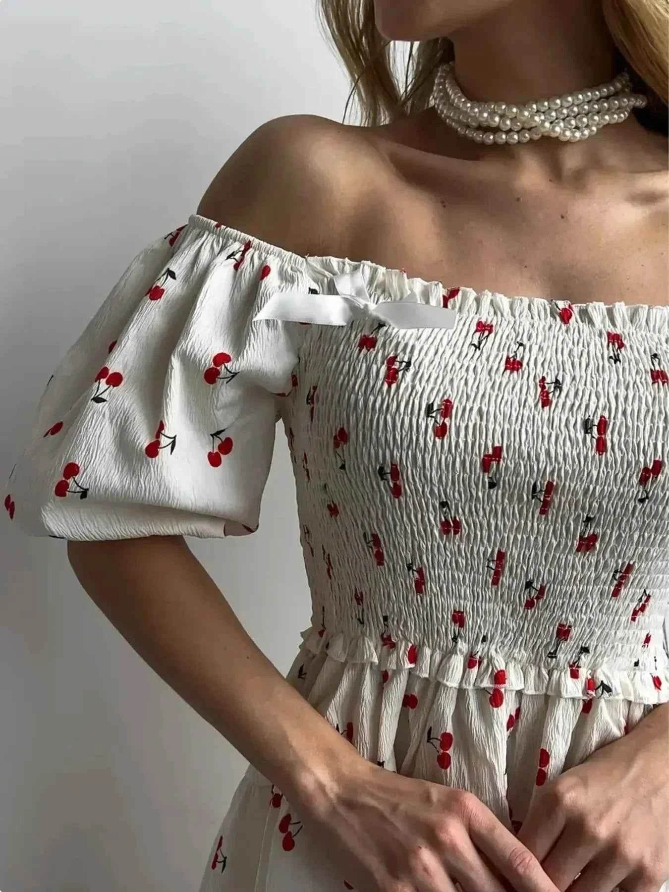 Puff Sleeve Cherry Print Smocked Mini Dress.