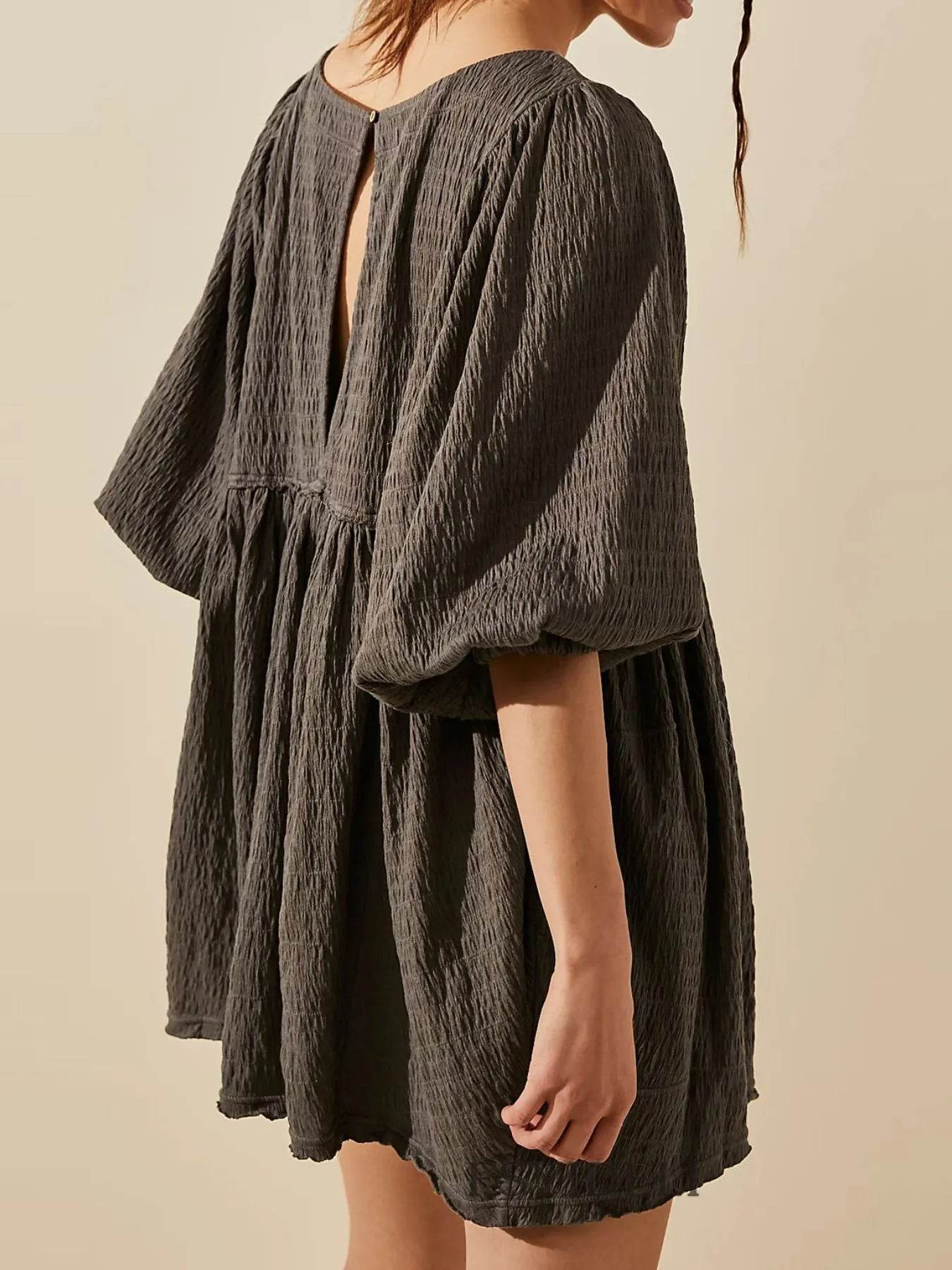 Relaxed Textured Babydoll Mini Dress with Keyhole Back.