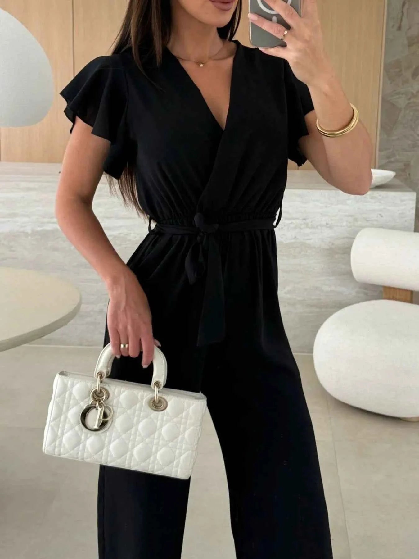 Surplice Wide Leg Belted Jumpsuit.