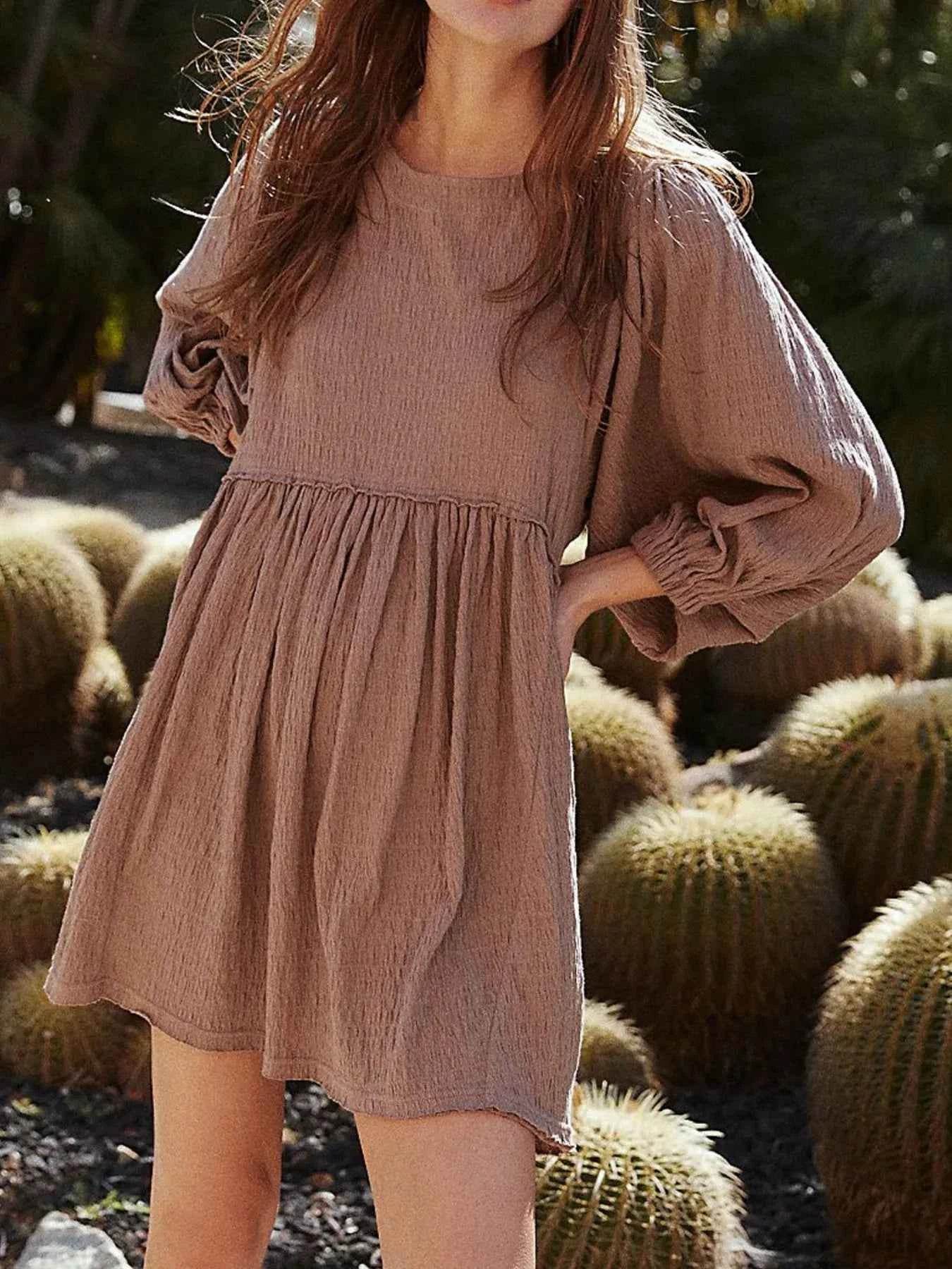 Relaxed Textured Babydoll Mini Dress with Keyhole Back.