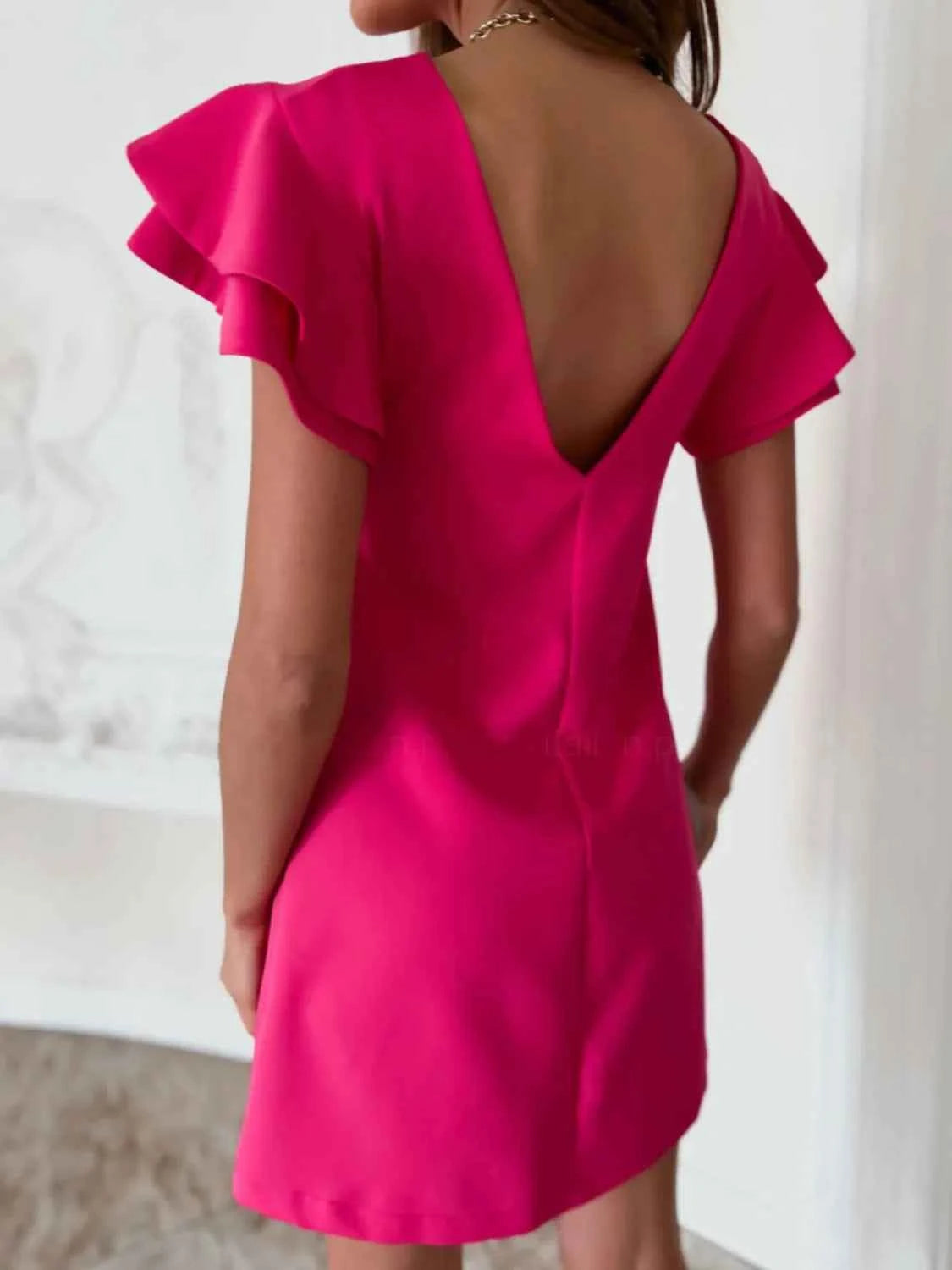 Ruffled Layered Backless Mini Dress.