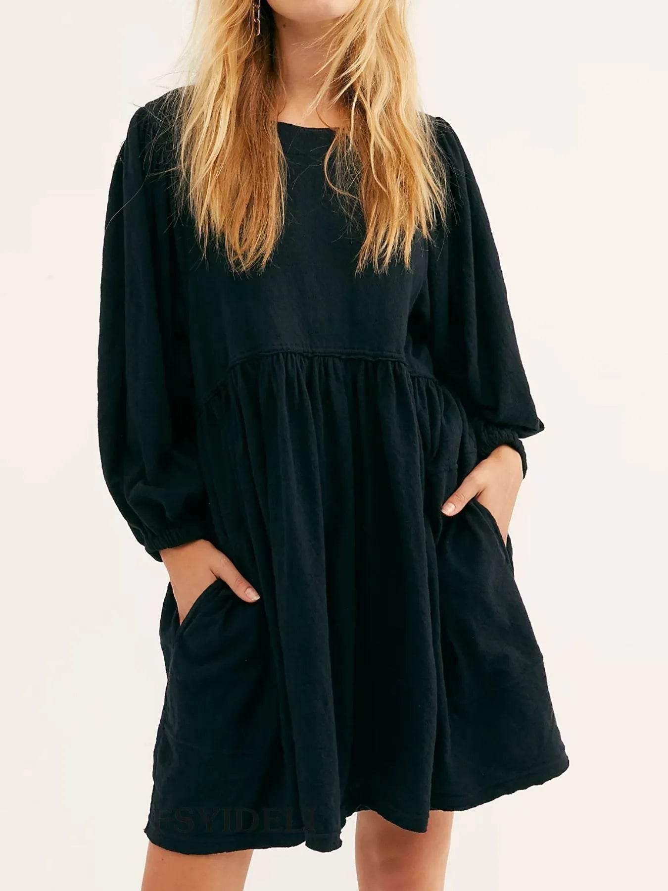 Relaxed Textured Babydoll Mini Dress with Keyhole Back.