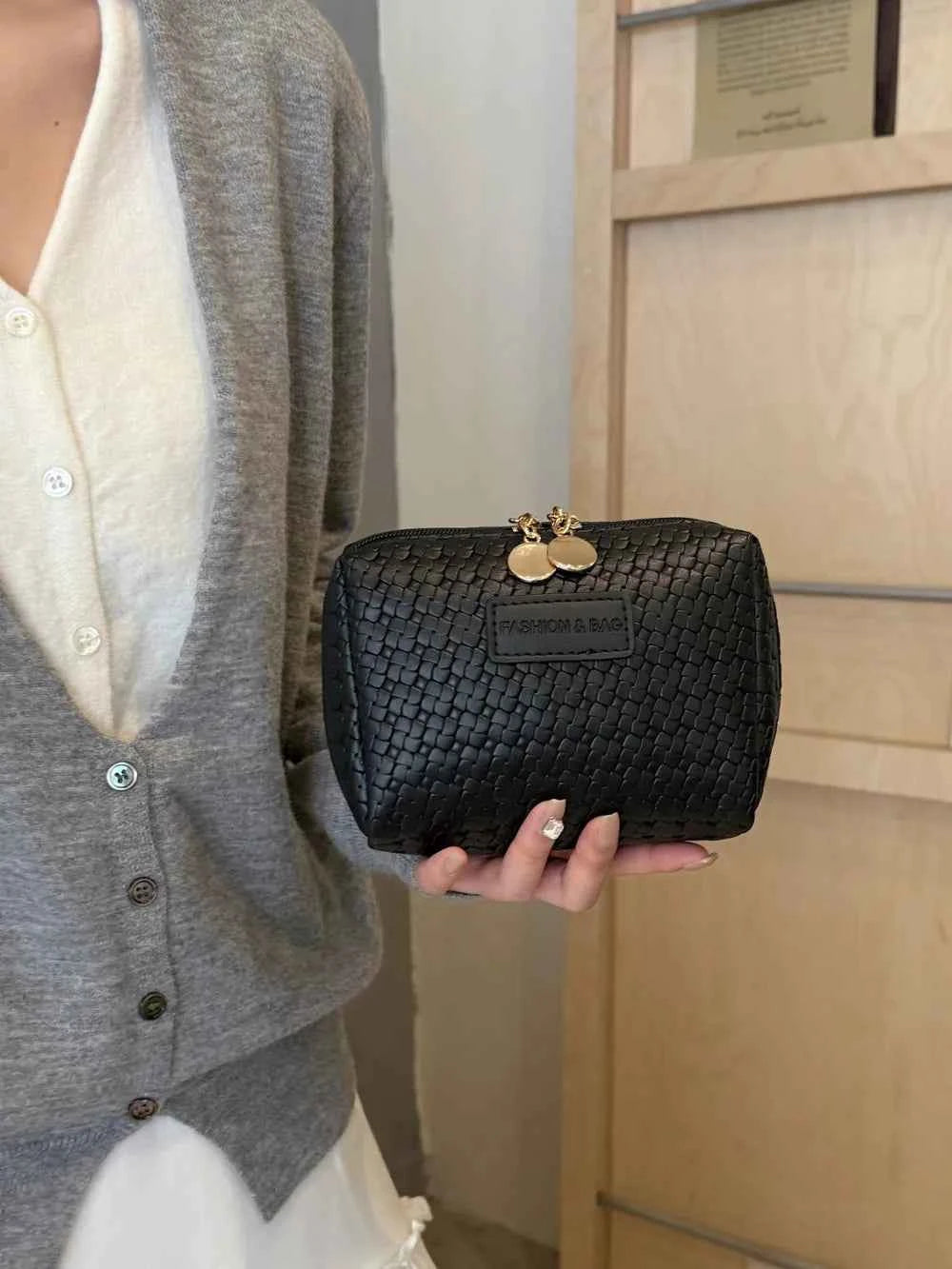 PU Leather Woven Clutch Bag.