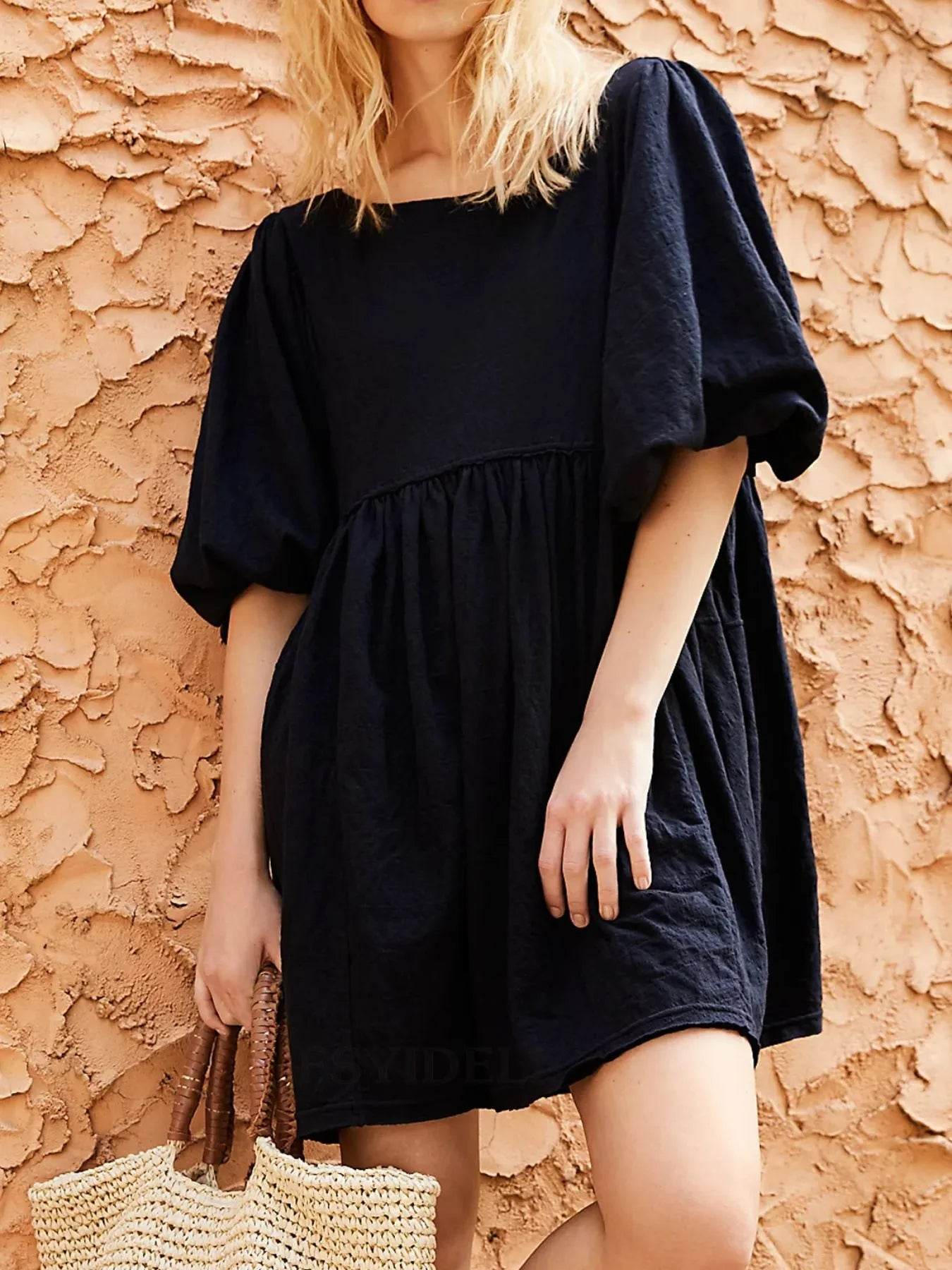 Relaxed Textured Babydoll Mini Dress with Keyhole Back.