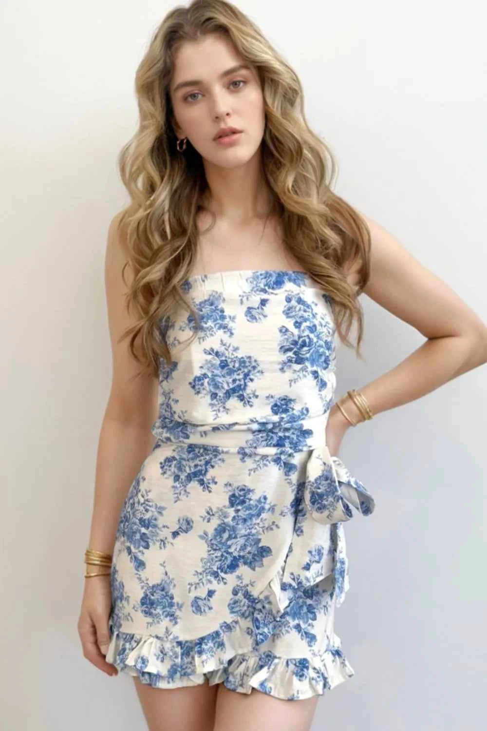 Printed Strapless Ruffle Hem Wrap Romper.