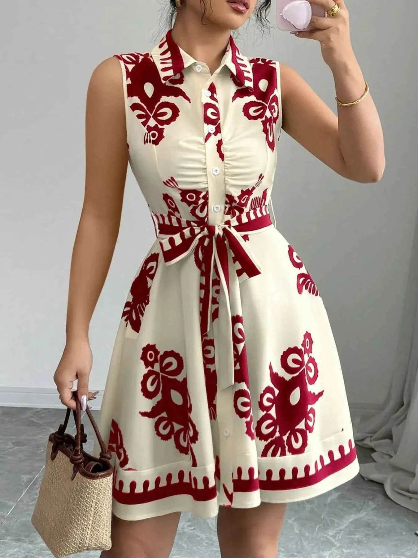 Printed Sleeveless Tie Waist Mini Dress.