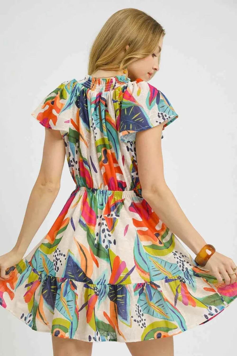 Umgee Tropical Print Tie Neck Ruffled Hem Mini Dress.
