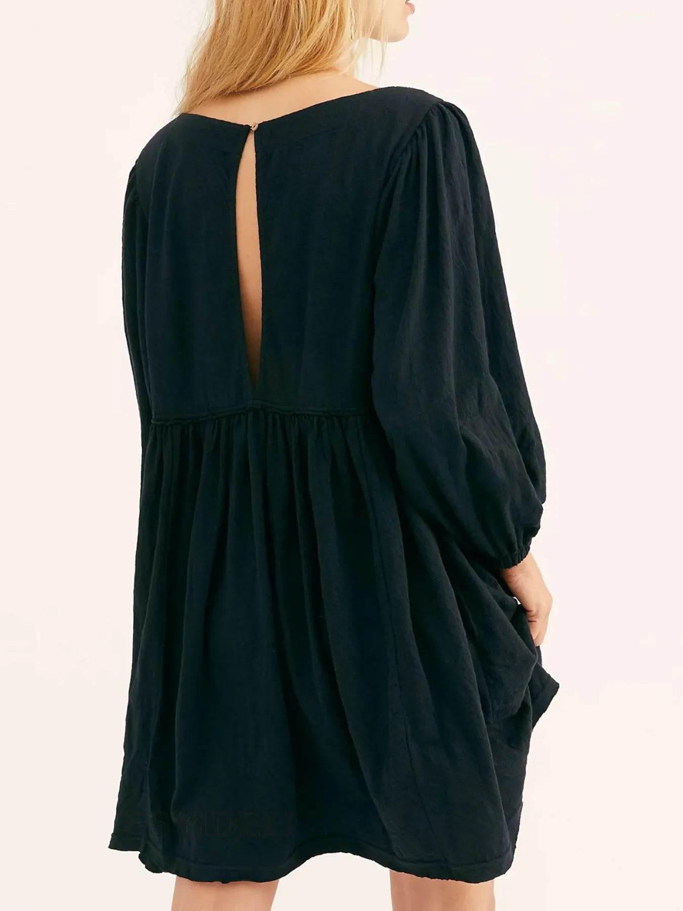 Relaxed Textured Babydoll Mini Dress with Keyhole Back.