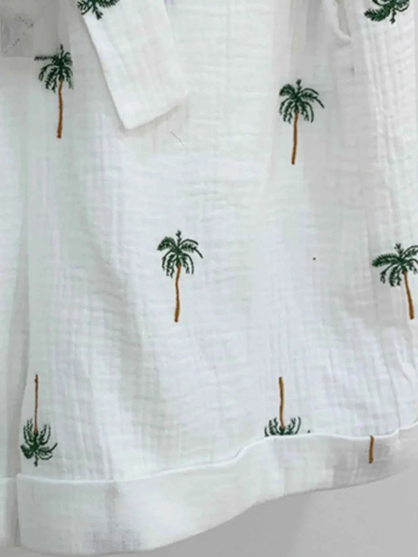 Palm Tree Print Short Sleeve Button-Up Romper with Belt.