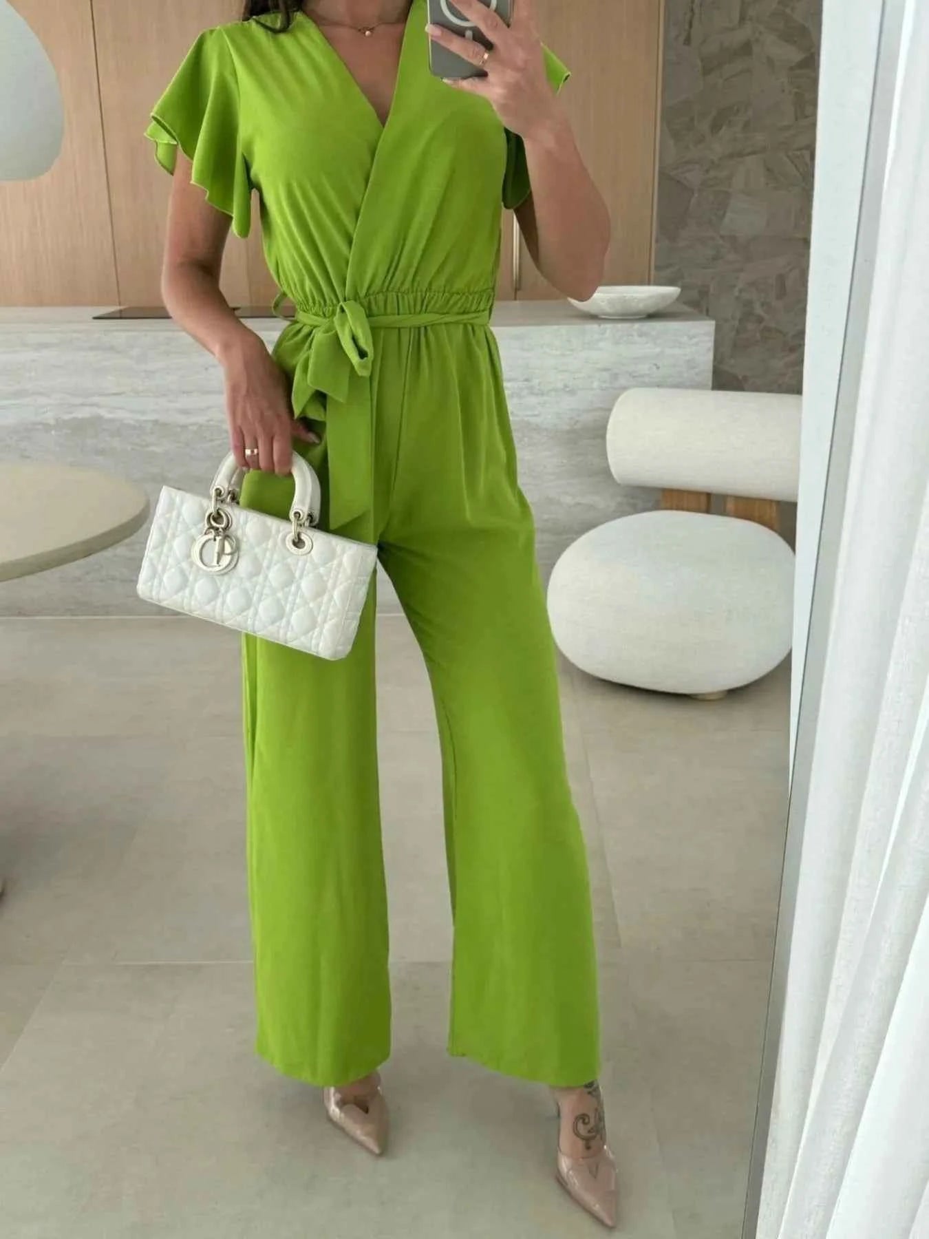 Surplice Wide Leg Belted Jumpsuit.