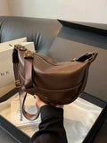 Stylish Leather Shoulder Bag with Woven Strap.
