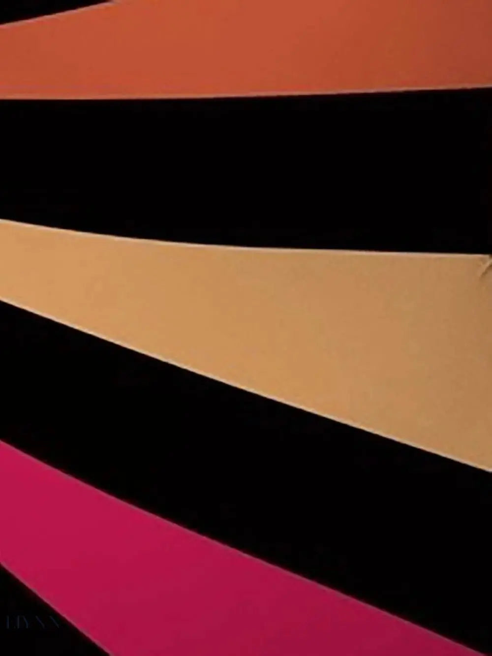 Close-up of striped women's swimwear featuring vibrant colors like orange, pink, and black