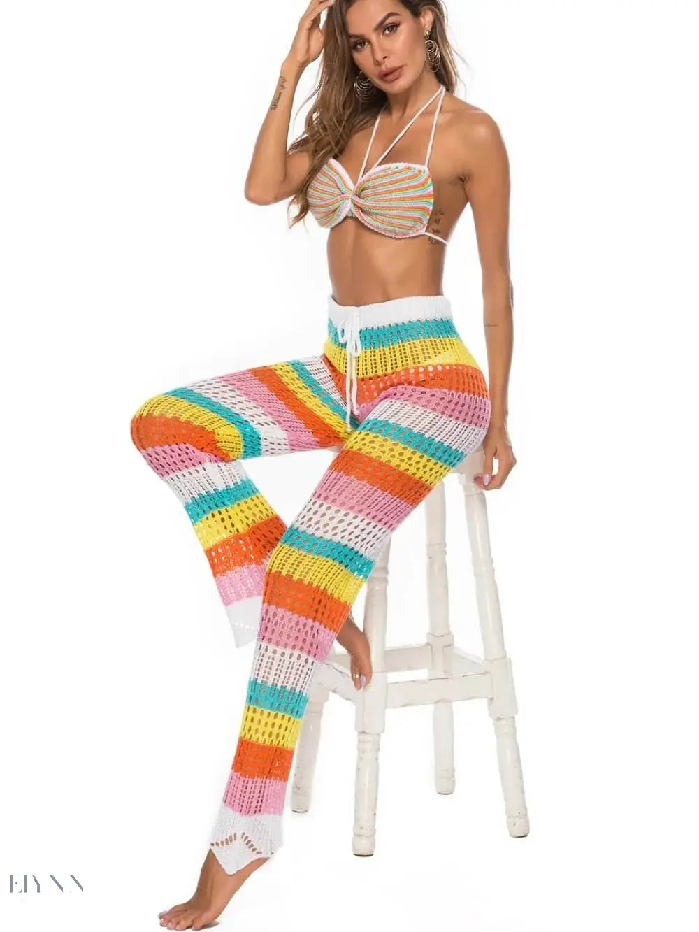 Trendy Women's Colorful Resort Wear Set featuring a striped bikini top and matching high-waisted pants