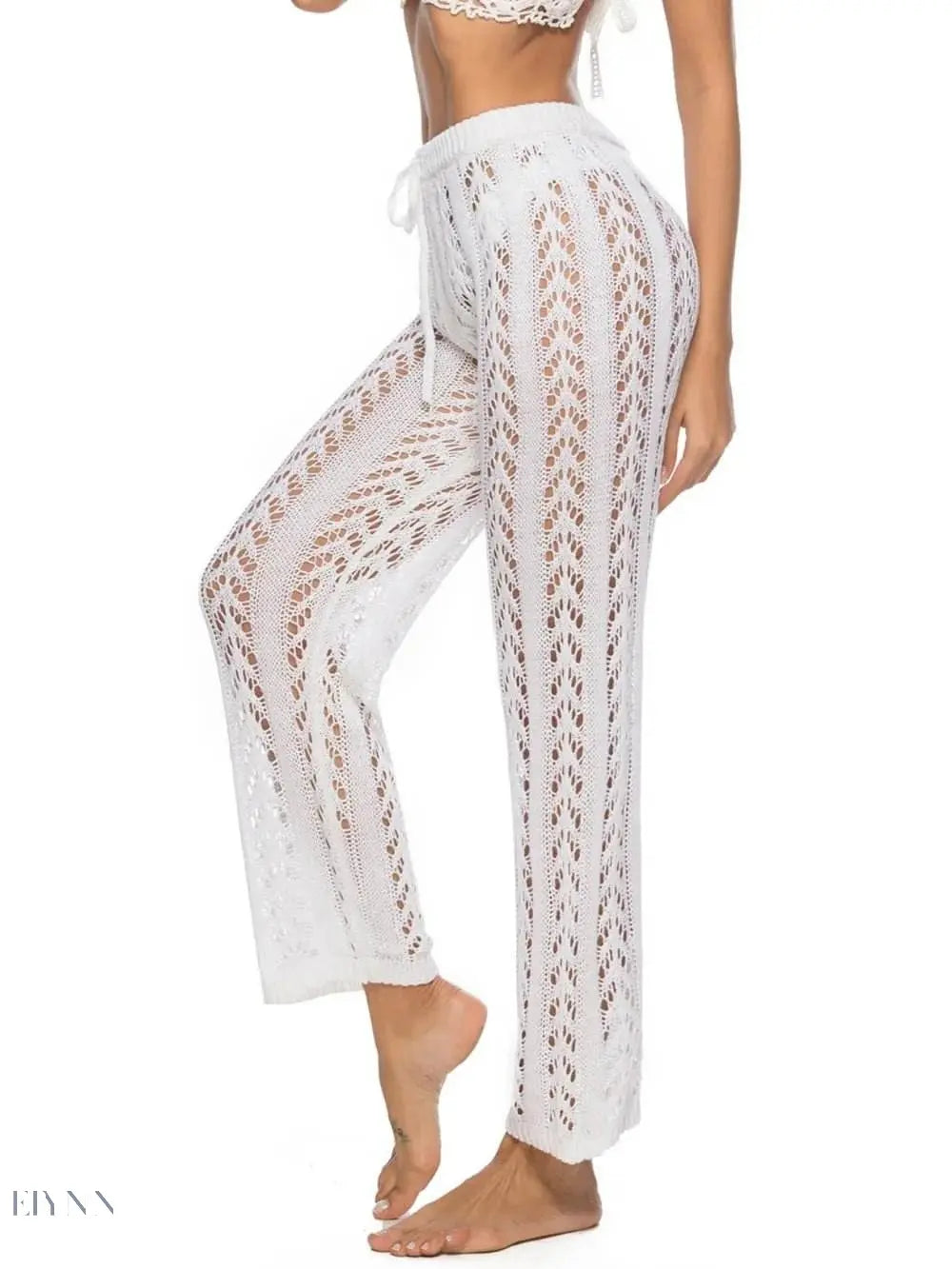 Trendy women's drawstring beach pants in white featuring a lace design for a stylish summer look